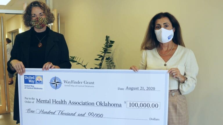 United Way of Central Oklahoma President and CEO, Debby Hampton, awarding Mental Health Association's MJ Clausen the WayFinder Innovation Grant