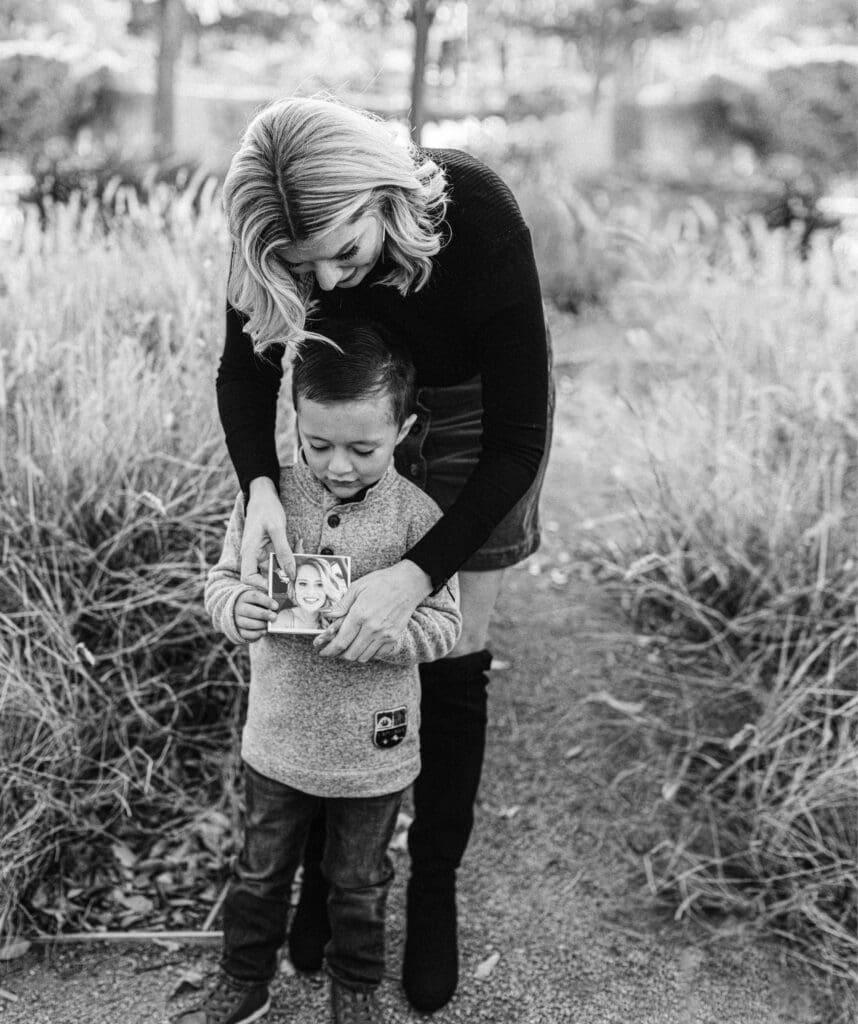 Mother leaning over child
